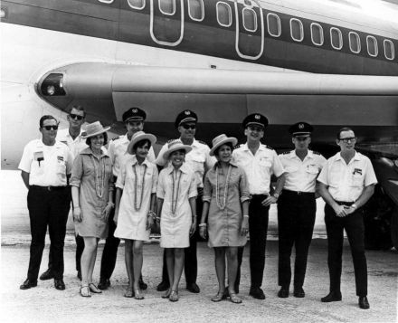 <p>Air Micronesia flight crew at Ponape (Pohnpei) International Airport, c. 1968-1969<br />
Deketik, Micronesia</p>
<p>Air Micronesia was established in 1968 by Continental Airlines and commonly referred to by its nickname, “Air Mike.” Originally based in Saipan, the airline played a large role in the development of Micronesia by bringing in tourism and giving locals easier access to other countries.</p>
<p>Trust Territory Photo Archives, University of Hawaii-Manoa Library.</p>
