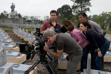 <p>Cinematographer Buddy Squires, production assistant Dinh Duc Thanh, director Lynn Novick, producer Sarah Botstein, and co-producer Ho Dang Hoa film at the Truong Son Military Cemetery, c. 2007-2017<br />
Vinh Truong, Vietnam<br />
Photograph by Jared Ames</p>
<p>In 1995, the United States and the Socialist Republic of Vietnam normalized relations and opened a new chapter of cooperation and contacts. Twelve years later, acclaimed documentarian Ken Burns and Lynn Novick began a decade-long film project, <em>The Vietnam War</em>, a series which explores the human dimensions of the war through testimony of witnesses from all sides.</p>
<p>Public Broadcasting Station</p>

