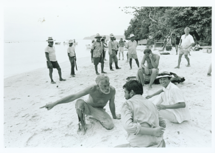 <p>Actor Lee Marvin (foreground, left) and Toshiro Mifune (front, center) on the set of <em>Hell in the Pacific</em>, 1968<br />
Rock Islands, Palau</p>
<p>American Lee Marvin and Japanese actor Toshiro Mifune, both of whom served in the Pacific during World War II, starred in the action film <em>Hell in the Pacific</em>. The film follows two WWII servicemen who are stranded together on a deserted island and, after several attempts to sabotage one another, realize they must overcome their differences in order to survive.</p>
<p>Trust Territory Photo Archives, University of Hawaii-Manoa Library.</p>
