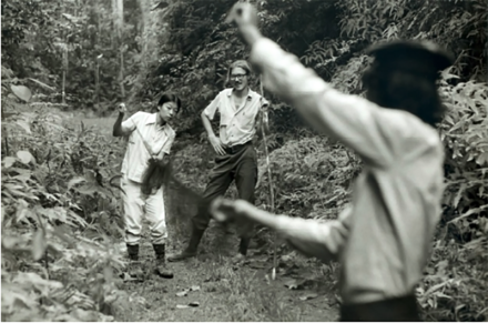 <p>Bottom: Peace Corps Volunteers Marina Wong (left) and Peter Becker (center) conducting research, 1980<br />
South of Kuala Lumpur, Malaysia</p>

