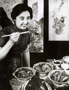 <p>Joyce Chen sampling one of her dishes, 1967<br />
Boston, Massachusetts<br />
Courtesy of the Library of Congress, Prints and Photographs Division, NYWTS-BIOG-Chen, Joyce Teacher</p>
