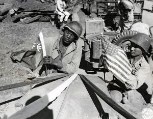 <p>An American and a Chinese soldier placing each other’s flags on a Jeep, 1945<br />
Ledo, India<br />
Photograph by Sergeant John Gutman<br />
Courtesy of the National Archives at College Park, MD, Still Picture Unit, 208-AA-338-A-1</p>

