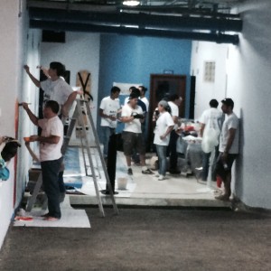 The group starts working on the indoor mural
