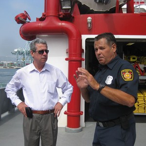 Discussing security and interdepartmental communication aboard LA City Fireboat #2, Port of Los Angeles From left to right: Capt. Juan Carlos Acosta Rodríguez and George Serrano
