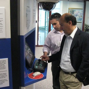 Looking at interactive system display Left to right: Daniel Ruz, Jorge Leyton