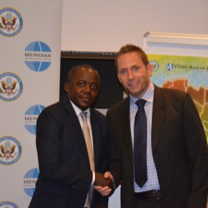 Jason Green of the U.S. Department of State (right)  and Donatien Lyhé Dioumy Moubassango, CEO of People 101.5, Gabon