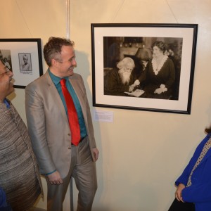 Lindsay Amini, Acting U.S. Consul General Cory Wilcox, and Dr. Jayanta Sengupta in front of Kindred Nations photograph of Helen Keller and Nobel Laureate Rabindranath Tagore