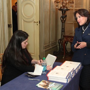 Jay Newton-Small signs a copy of her book for The Honorable Anita McBride, former Chief of Staff to First Lady Laura Bush.