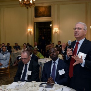 Ambassador of Morocco Mohammed Rachad Bouhlal poses a question to the panelists, while Ambassador of Mozambique Carlos Dos Santos, to his immediate right, listens intently.