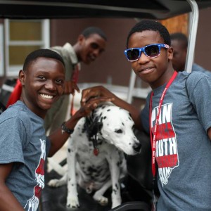 Lusayo and Joseph from Malawi make a new friend at Camp Adventure, Indiana