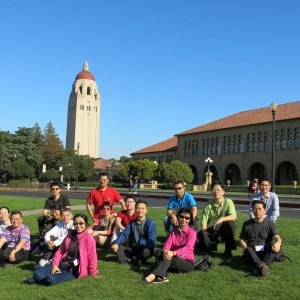 Delegates relax on the front lawn of Stanford University after a tour of the campus.