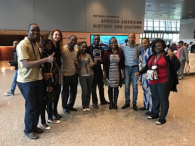 Participants take a group photo at the National Museum of African American History and Culture