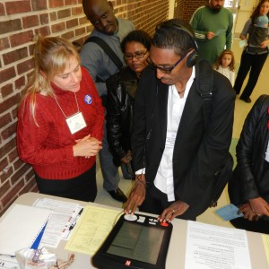 Visitors at a voter registration booth