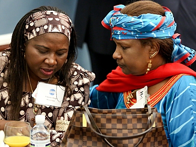 Mozambique’s Minister of Work, Employment and Social Security Vitoria Diogo shares a moment with Mariama Bayard-Gamatié, a Nigerien politician and women's rights activist.