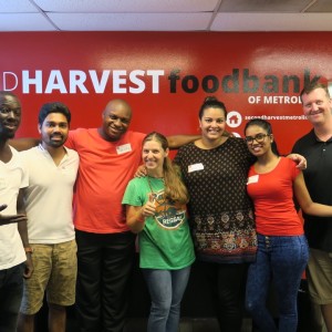 Participants take a group photo after volunteering at Second Harvest Food Bank in Charlotte, North Carolina