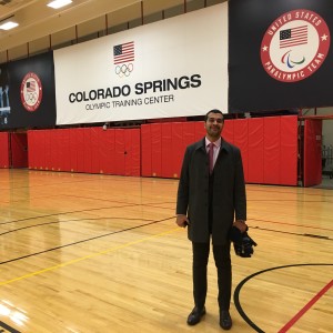 Mr. Amine Zariat takes a photo on the basketball court of the Colorado Springs Olympics Training Center