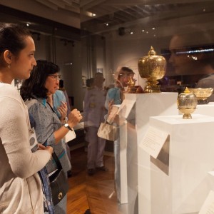 Visitors admire gold nielloware given by King Bhumibol Adulyadej and Queen Sirikit to U.S. presidents