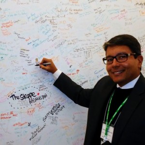 IVLP participant Fabricio signing the wall at Facebook in Washington, DC