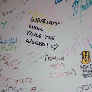 IVLP participant Fabricio signing the wall at Facebook in Washington, DC