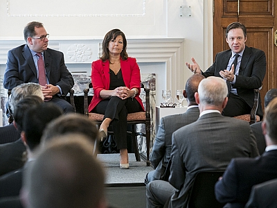 L to R: POLITICO Reporters Charlie Mahtesian, Lorraine Woellert and Michael Crowley address remarks to the audience of diplomats and leaders. Photo by Kristoffer Tripplaar.