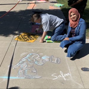 An IVLP participant presents her Chalk Slam cartoon.