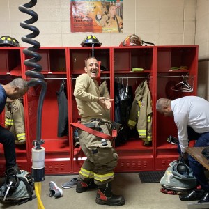 Visitors trying on fire fighting gear at Kalamazoo Airport