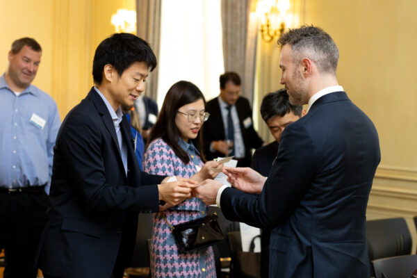 Takanori Hattori, First Secretary of Finance at the Embassy of Japan, exchanges business cards with Jacob Kloper-Owens, International Economist and Senior Advisor at the U.S. Department of the Treasury before an Insights@Meridian program at Meridian House in Washington, D.C. on July 26, 2023. Photo by Jess Latos.
