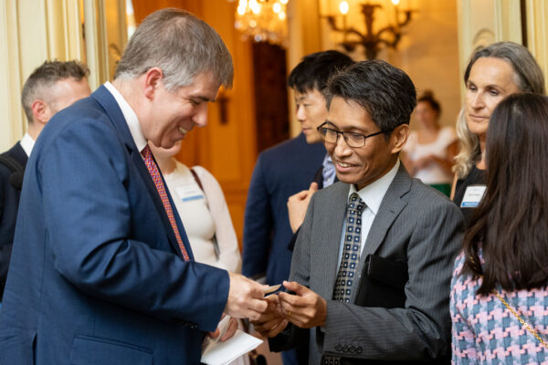 The Honorable Jay Shambaugh exchanges business cards with Thet Win, Charge D’Affaires at the Embassy of the Republic of the Union of Myanmar after an Insights@Meridian program at Meridian House in Washington, D.C. on July 26, 2023. Photo by Jess Latos